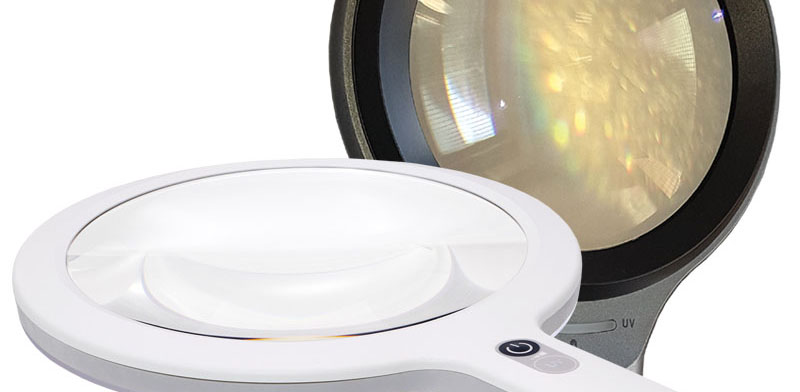 Hand held illuminated examination magnifiers