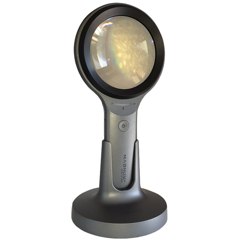Illuminated hand held examination magnifier